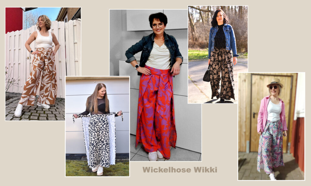 Frauen in gemusterten Wickelhosen stehen draußen.