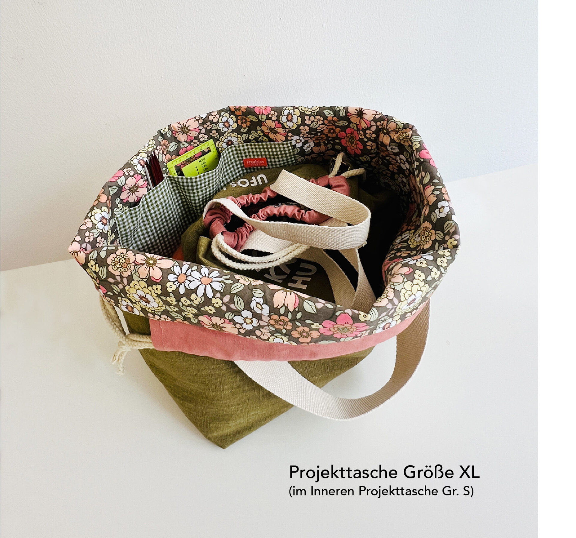 projekttaschen, oliv/rosé Bunte Tasche mit mehreren Fächern im Inneren.